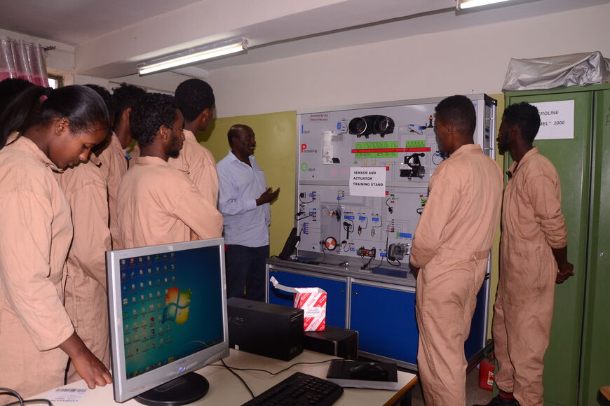 Teacher explains a plan to the participants