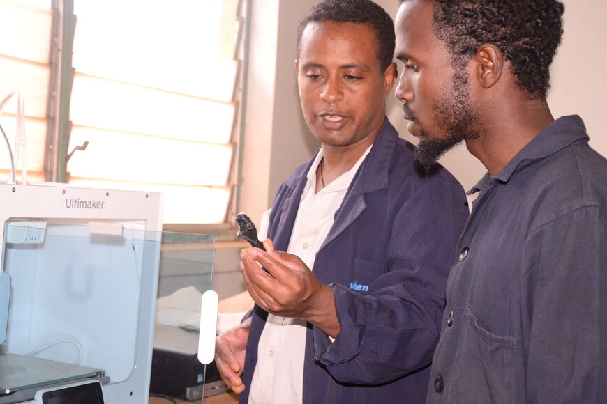 Teacher explains a component to a participant